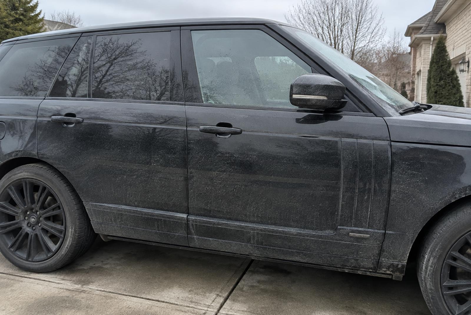 SUV exterior covered in dust and road grime before detailing